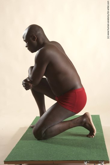 Underwear Man Black Kneeling poses - ALL Average Bald Kneeling poses - on one knee Academic