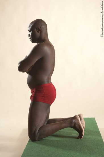 Underwear Man Black Kneeling poses - ALL Average Bald Kneeling poses - on both knees Academic