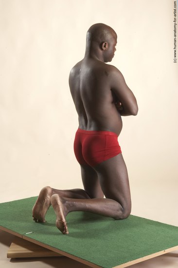 Underwear Man Black Kneeling poses - ALL Average Bald Kneeling poses - on both knees Academic