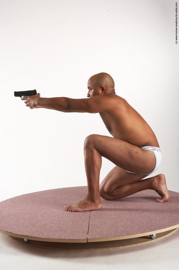 Underwear Fighting with gun Man Black Kneeling poses - ALL Average Bald Kneeling poses - on one knee Academic