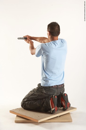 Casual Fighting with gun Man White Kneeling poses - ALL Slim Short Brown Kneeling poses - on both knees Academic