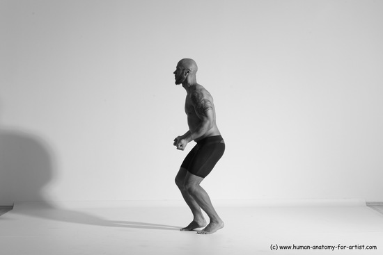 Underwear Gymnastic poses Man Black Muscular Bald Dancing Dynamic poses Academic