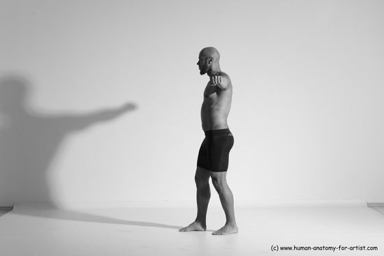 Underwear Gymnastic poses Man Black Muscular Bald Dancing Dynamic poses Academic