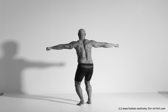 Underwear Gymnastic poses Man Black Muscular Bald Dancing Dynamic poses Academic