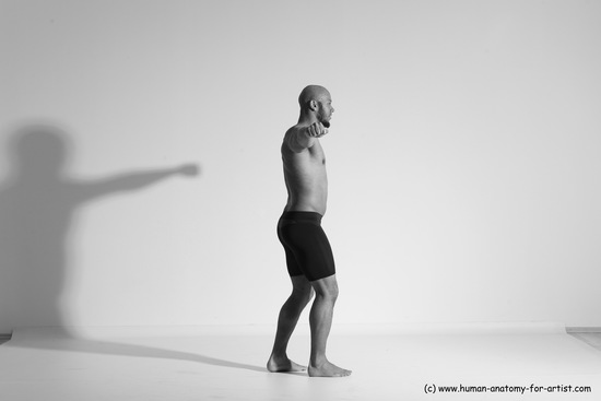 Underwear Gymnastic poses Man Black Muscular Bald Dancing Dynamic poses Academic