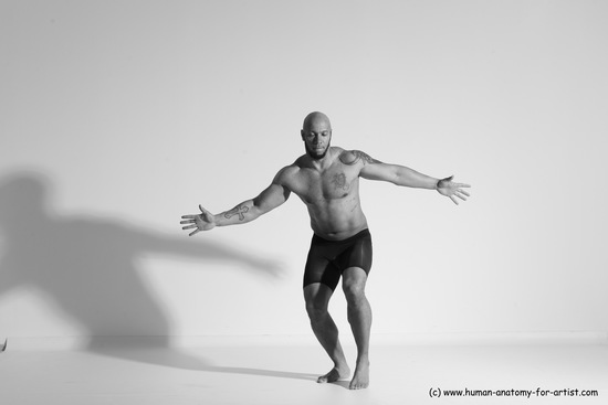 Underwear Gymnastic poses Man Black Muscular Bald Dancing Dynamic poses Academic