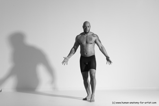 Underwear Gymnastic poses Man Black Muscular Bald Dancing Dynamic poses Academic