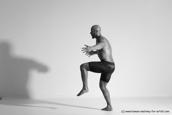 Underwear Gymnastic poses Man Black Muscular Bald Dancing Dynamic poses Academic