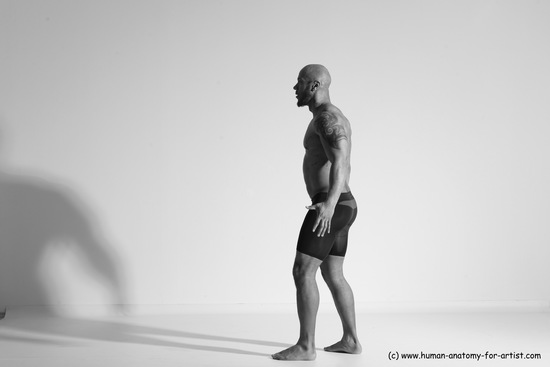 Underwear Gymnastic poses Man Black Muscular Bald Dancing Dynamic poses Academic