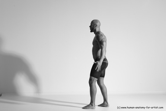 Underwear Gymnastic poses Man Black Muscular Bald Dancing Dynamic poses Academic