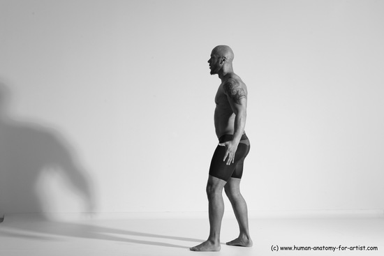 Underwear Gymnastic poses Man Black Muscular Bald Dancing Dynamic poses Academic