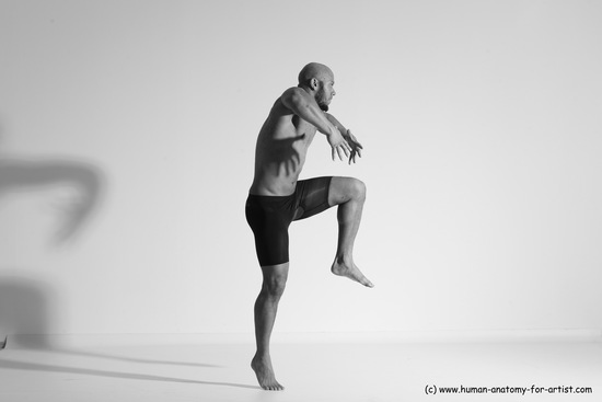 Underwear Gymnastic poses Man Black Muscular Bald Dancing Dynamic poses Academic