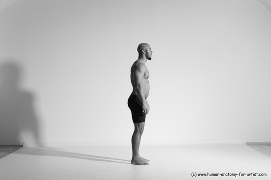 Underwear Gymnastic poses Man Black Muscular Bald Dancing Dynamic poses Academic