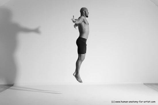 Underwear Gymnastic poses Man Black Muscular Bald Dancing Dynamic poses Academic