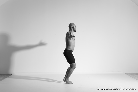 Underwear Gymnastic poses Man Black Muscular Bald Dancing Dynamic poses Academic