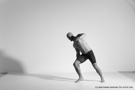 Underwear Gymnastic poses Man Black Muscular Bald Dancing Dynamic poses Academic