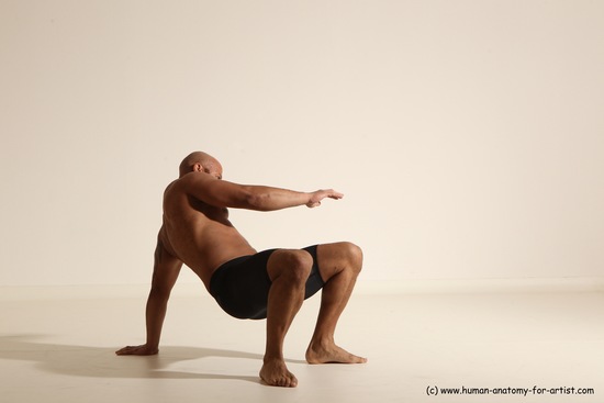 Underwear Gymnastic poses Man Black Muscular Bald Dancing Dynamic poses Academic