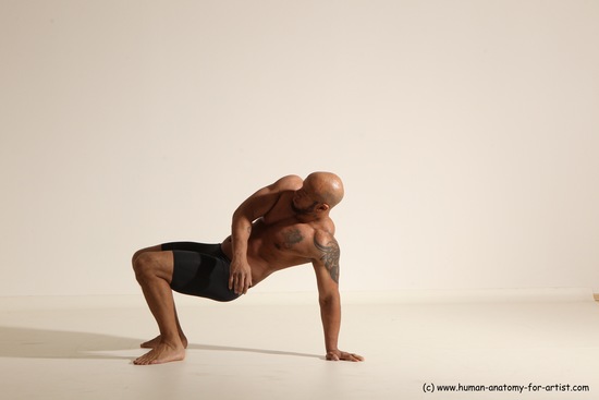 Underwear Gymnastic poses Man Black Muscular Bald Dancing Dynamic poses Academic