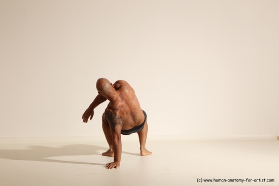 Underwear Gymnastic poses Man Black Muscular Bald Dancing Dynamic poses Academic