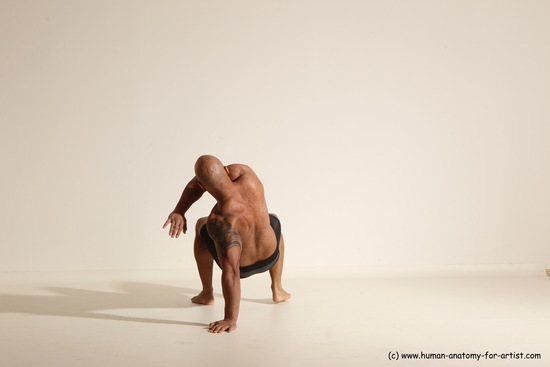 Underwear Gymnastic poses Man Black Muscular Bald Dancing Dynamic poses Academic