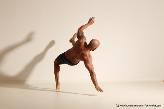 Underwear Gymnastic poses Man Black Muscular Bald Dancing Dynamic poses Academic