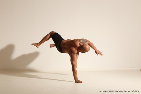 Underwear Gymnastic poses Man Black Muscular Bald Dancing Dynamic poses Academic