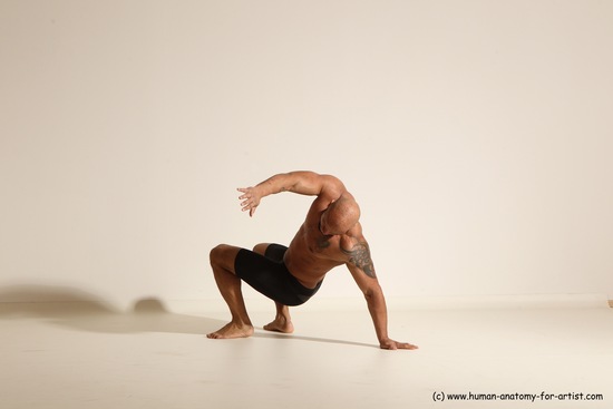 Underwear Gymnastic poses Man Black Muscular Bald Dancing Dynamic poses Academic