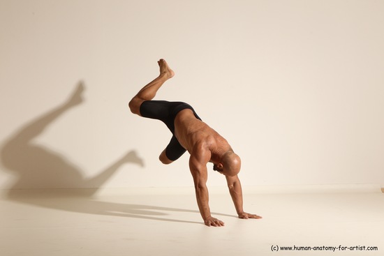 Underwear Gymnastic poses Man Black Muscular Bald Dancing Dynamic poses Academic