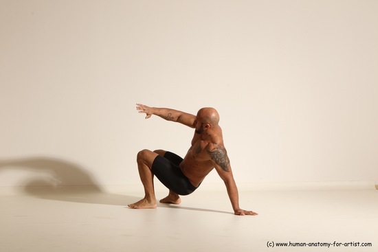 Underwear Gymnastic poses Man Black Muscular Bald Dancing Dynamic poses Academic