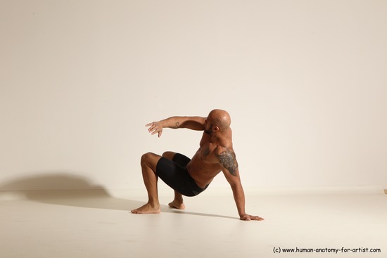 Underwear Gymnastic poses Man Black Muscular Bald Dancing Dynamic poses Academic