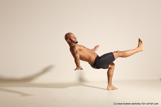 Underwear Gymnastic poses Man Black Muscular Bald Dancing Dynamic poses Academic