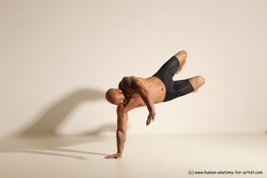 Underwear Gymnastic poses Man Black Muscular Bald Dancing Dynamic poses Academic