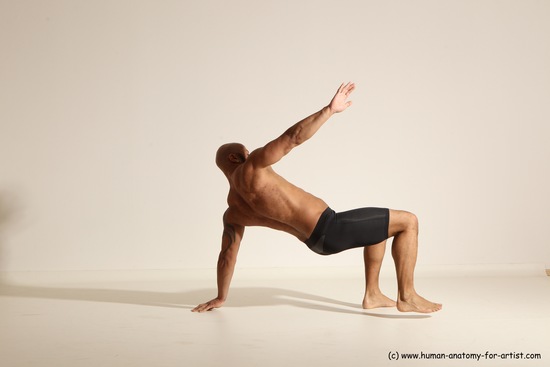 Underwear Gymnastic poses Man Black Muscular Bald Dancing Dynamic poses Academic