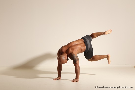 Underwear Gymnastic poses Man Black Muscular Bald Dancing Dynamic poses Academic