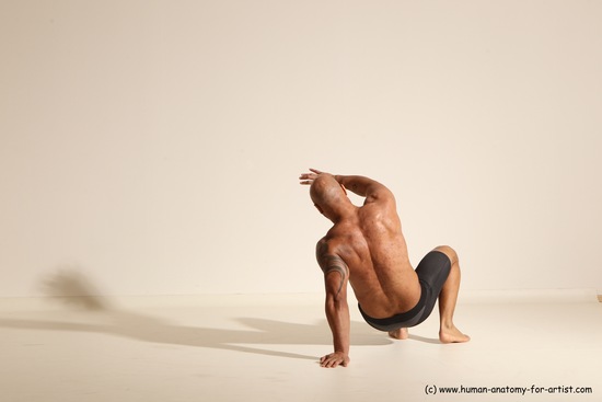 Underwear Gymnastic poses Man Black Muscular Bald Dancing Dynamic poses Academic