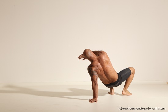 Underwear Gymnastic poses Man Black Muscular Bald Dancing Dynamic poses Academic