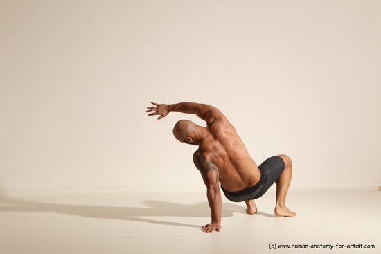 Underwear Gymnastic poses Man Black Muscular Bald Dancing Dynamic poses Academic