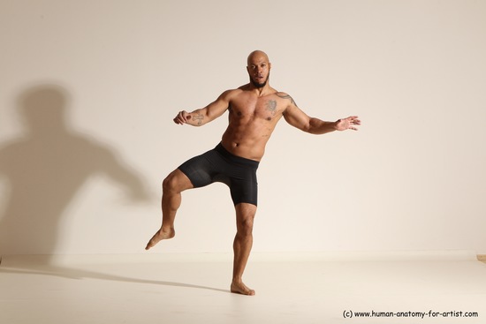 Underwear Gymnastic poses Man Black Muscular Bald Dancing Dynamic poses Academic