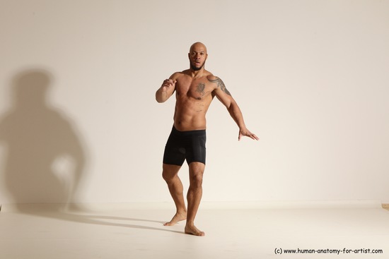 Underwear Gymnastic poses Man Black Muscular Bald Dancing Dynamic poses Academic