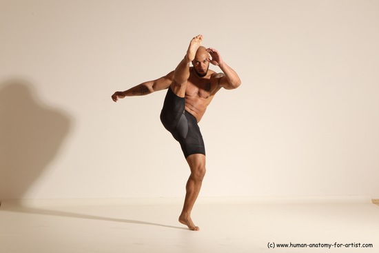 Underwear Gymnastic poses Man Black Muscular Bald Dancing Dynamic poses Academic