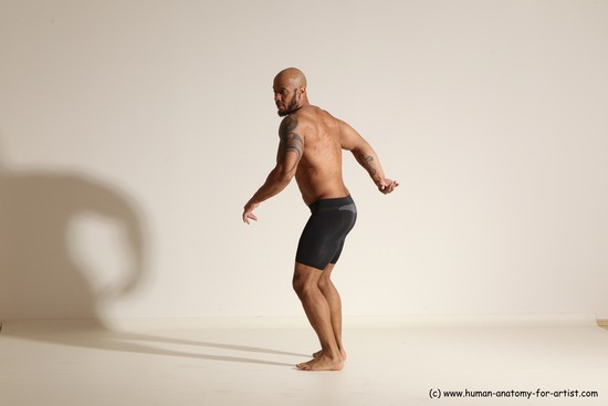 Underwear Gymnastic poses Man Black Muscular Bald Dancing Dynamic poses Academic