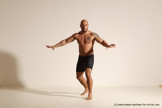 Underwear Gymnastic poses Man Black Muscular Bald Dancing Dynamic poses Academic