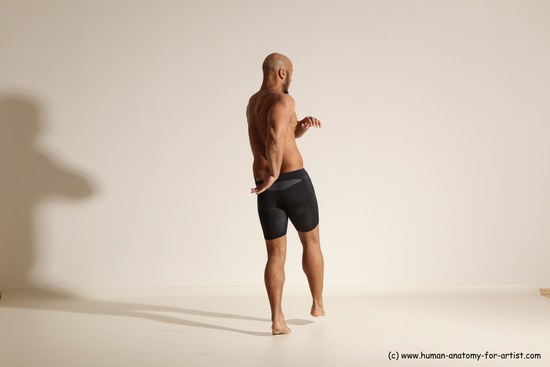 Underwear Gymnastic poses Man Black Muscular Bald Dancing Dynamic poses Academic