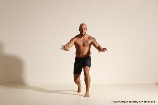 Underwear Gymnastic poses Man Black Muscular Bald Dancing Dynamic poses Academic