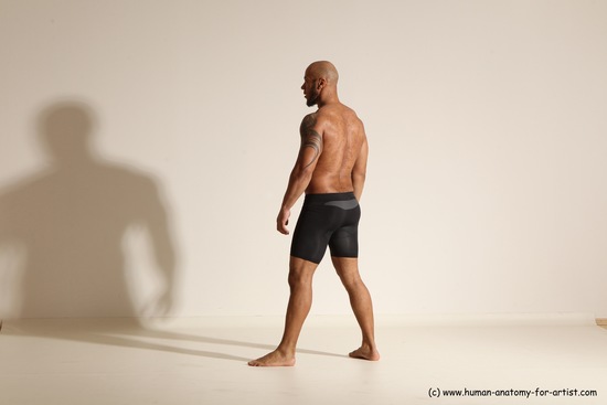 Underwear Gymnastic poses Man Black Muscular Bald Dancing Dynamic poses Academic