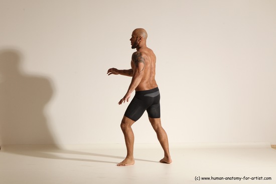 Underwear Gymnastic poses Man Black Muscular Bald Dancing Dynamic poses Academic