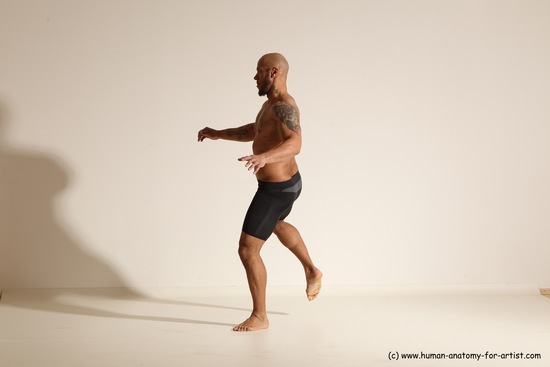 Underwear Gymnastic poses Man Black Muscular Bald Dancing Dynamic poses Academic