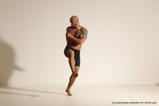 Underwear Gymnastic poses Man Black Muscular Bald Dancing Dynamic poses Academic