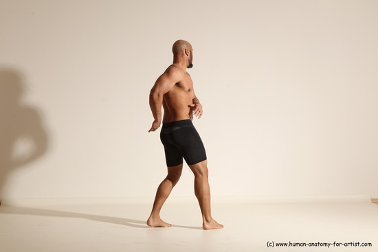 Underwear Gymnastic poses Man Black Muscular Bald Dancing Dynamic poses Academic