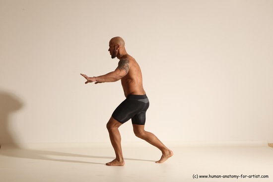 Underwear Gymnastic poses Man Black Muscular Bald Dancing Dynamic poses Academic